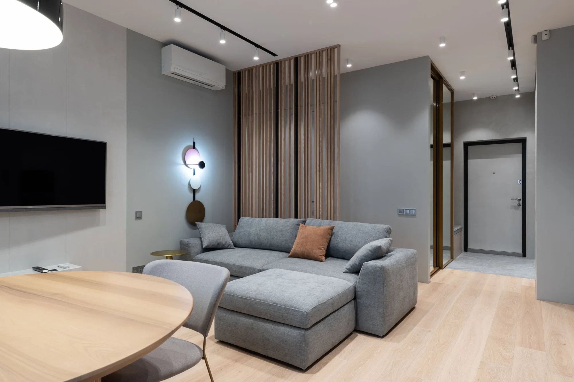 Bright, clean modern condo living room with large windows