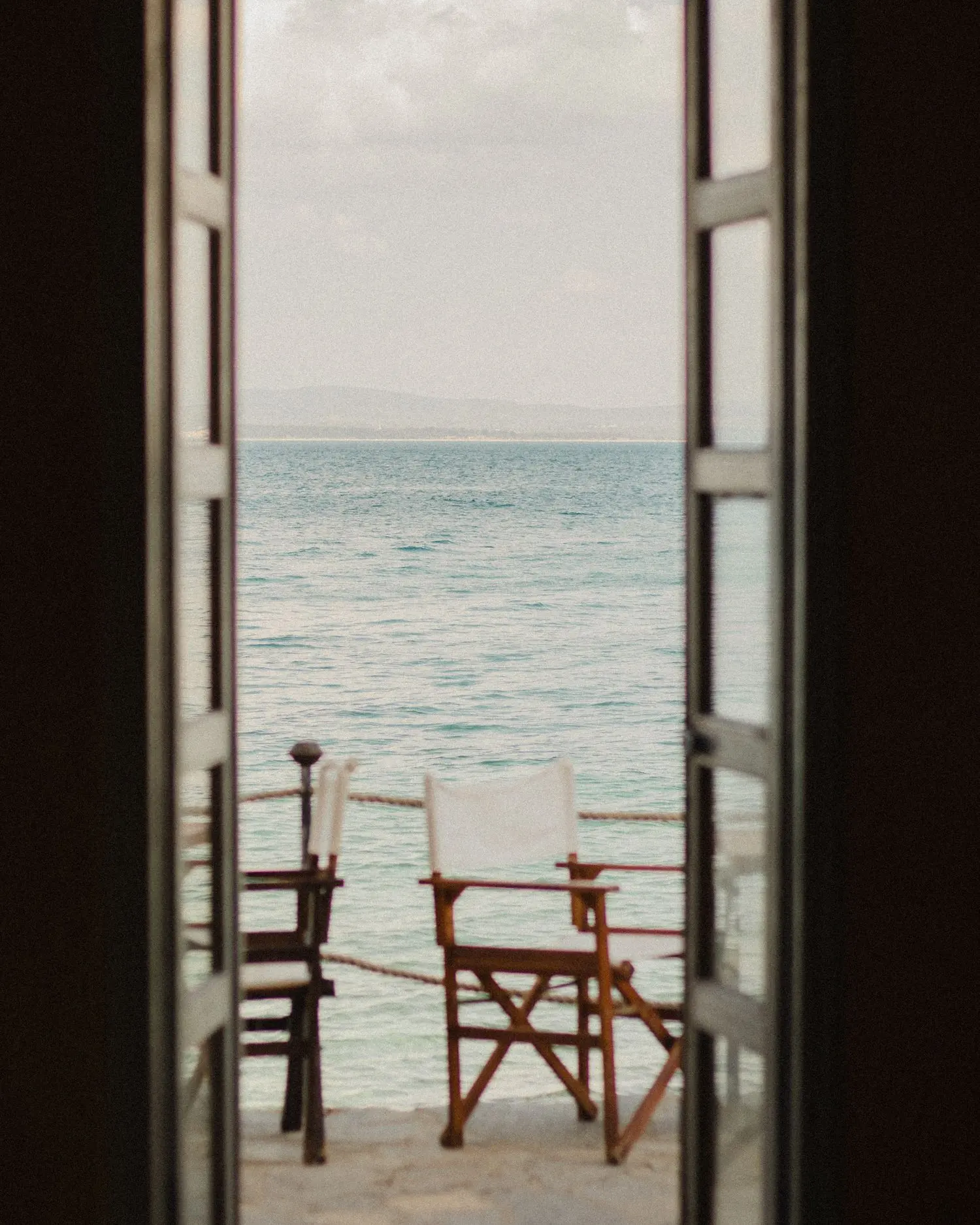 Open doors to an ocean view at a vacation rental